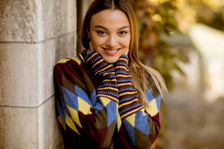 woman in striped jumper smiling