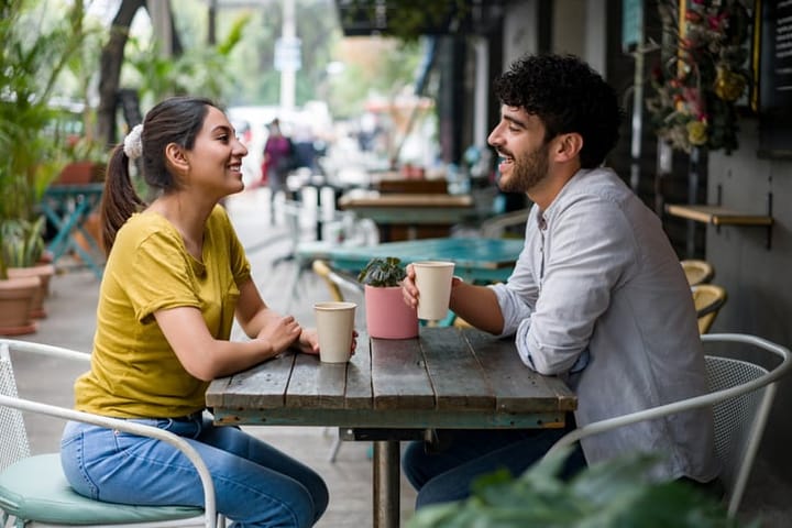 couple on sidewalk cafe date
