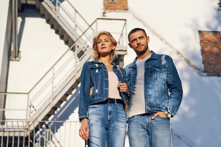 couple standing in denim clothing