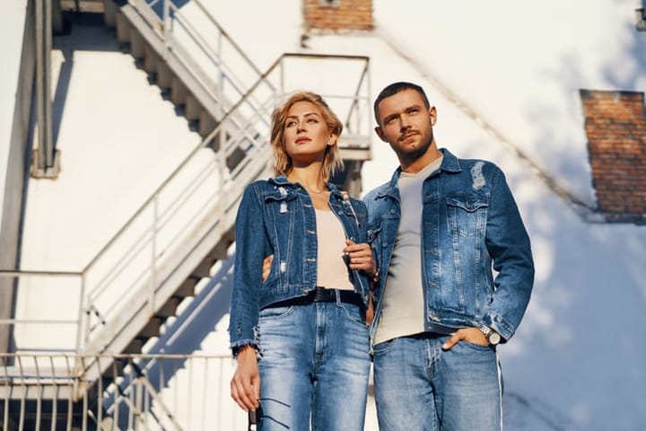 couple standing in denim clothing