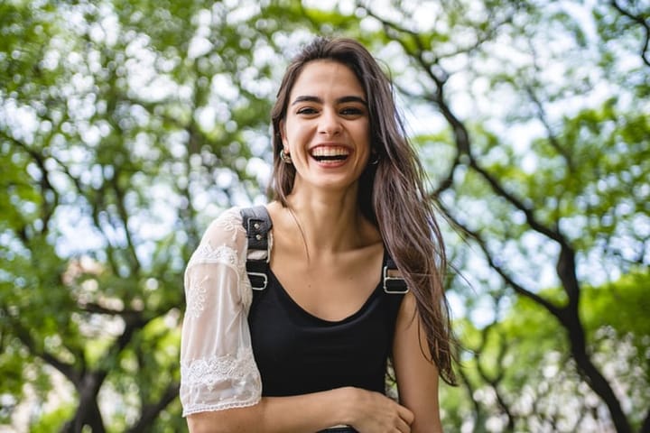 happy young smiling woman outdoors