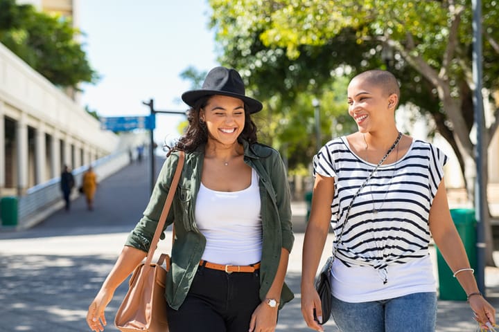 two women walking in park