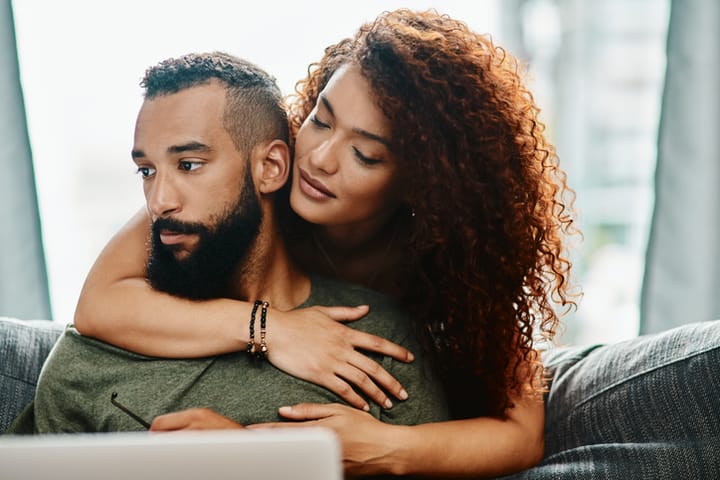woman hugging man from behind