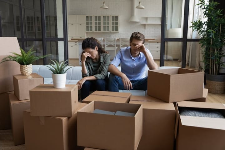 frustrated couple with moving boxes