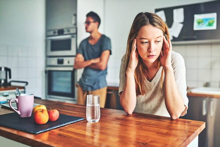 couple arguing in kitchen