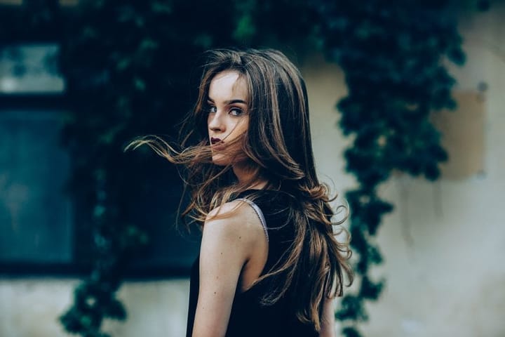 Attractive fashion woman in black dress