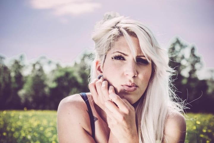 Blonde in a field of flowers