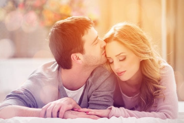 Young couple laid thoughtful