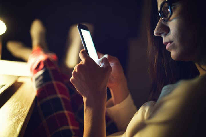 Girl looking at smartphone