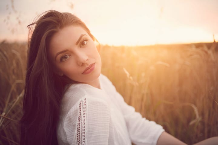 Portrait of a beautiful caucasian woman at sunset.