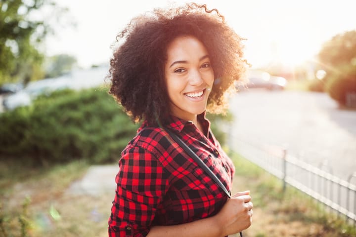 Portrait of beautiful mixed-race woman looking at camera
