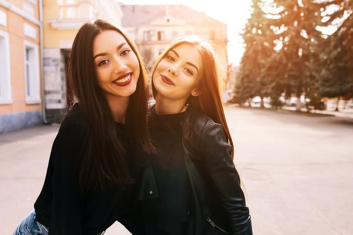 young women friends travel happy