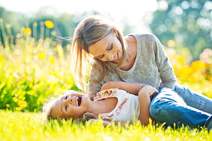 Mother and daughter having fun outdoors