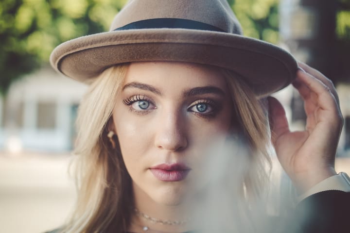 woman blue eyes hat