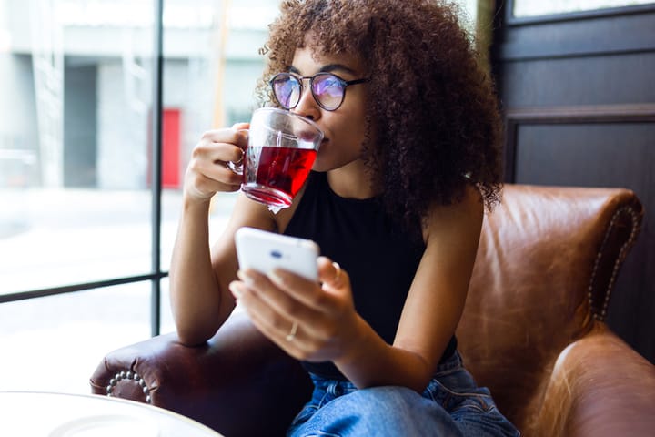 woman on phone at coffee shop