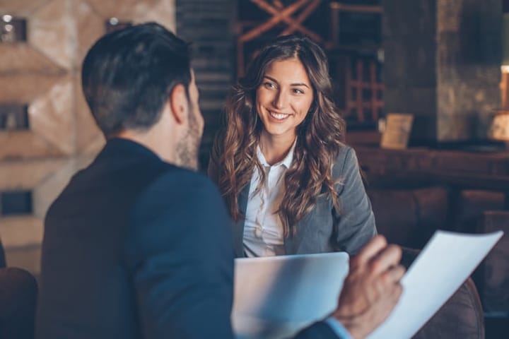 Woman having a meeting with her boss.