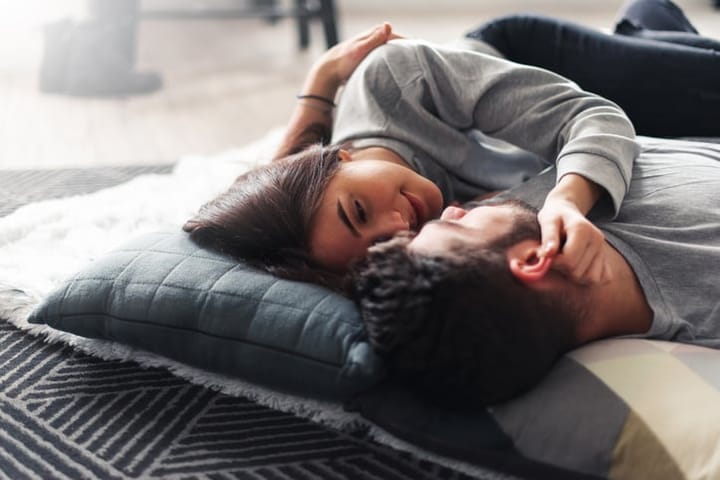 Two people cuddling.