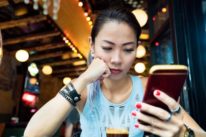 asian woman texting