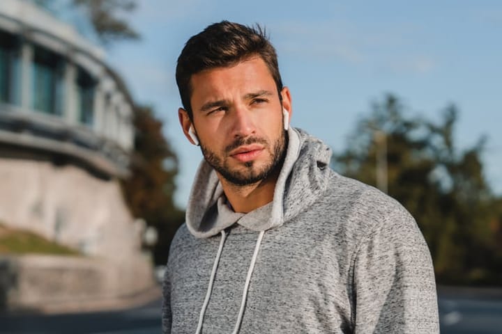 bearded man with air pods