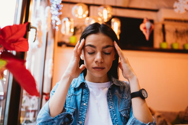 frustrated woman head in hands