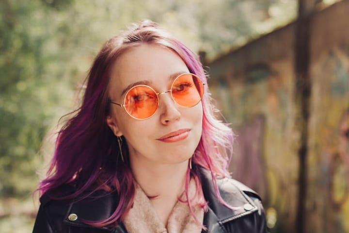 Woman in orange sunglasses.