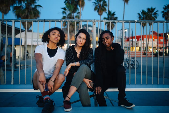three female friends at night