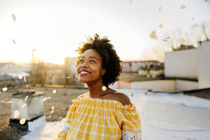 happy young black woman smiling