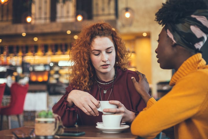 comforting a friend at the coffee shop