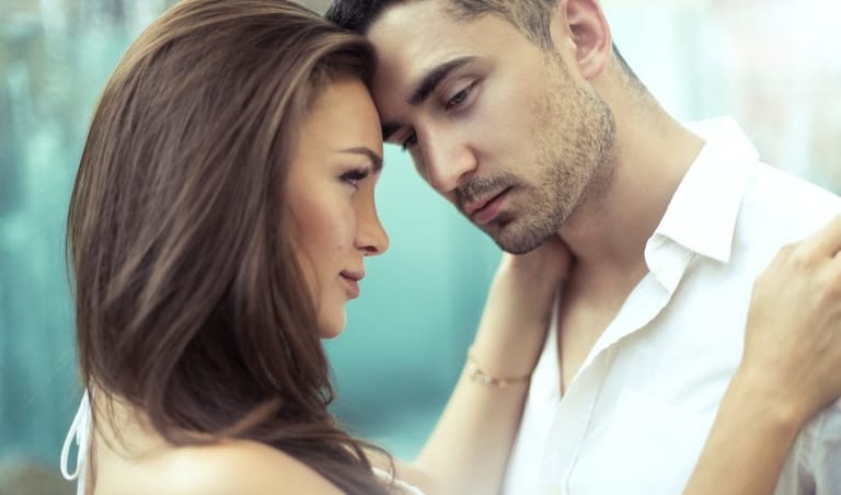 Young attractive couple holding each other