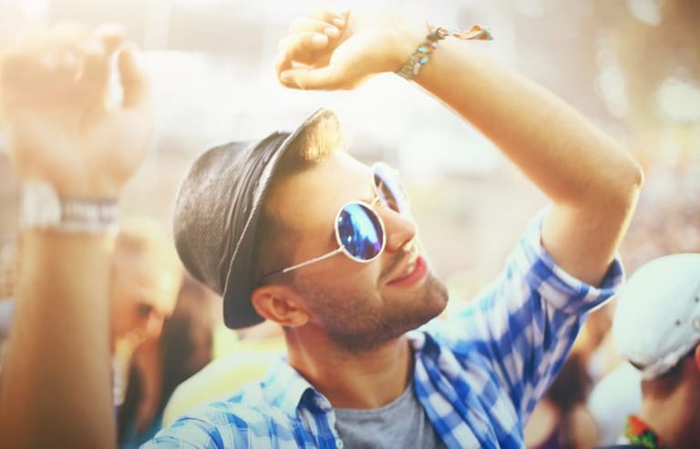 Hipster guy in shades dancing