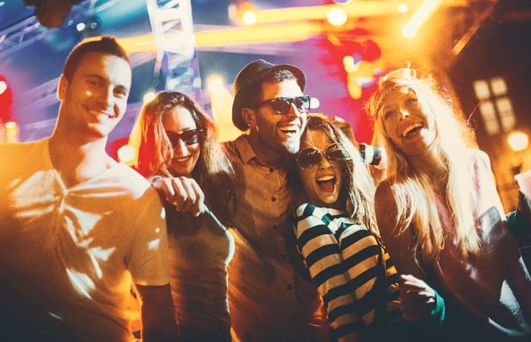 friends laughing at nighttime party