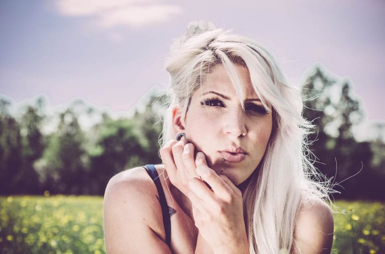 Blonde in a field of flowers