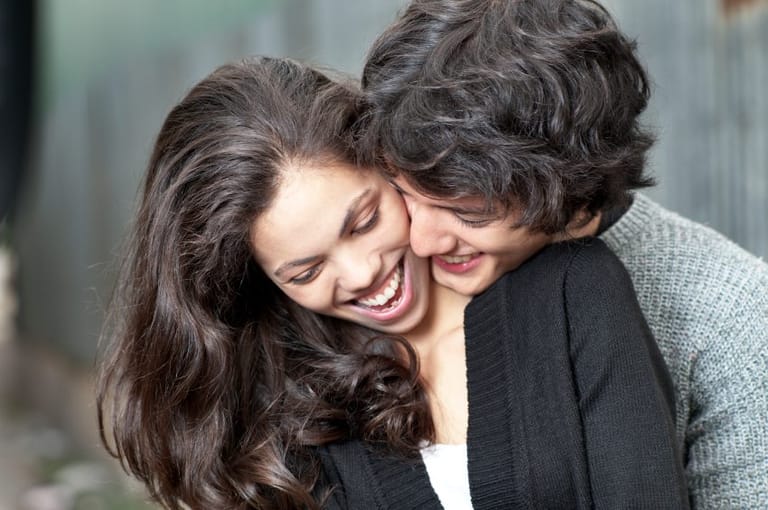 Dark haired couple laughing