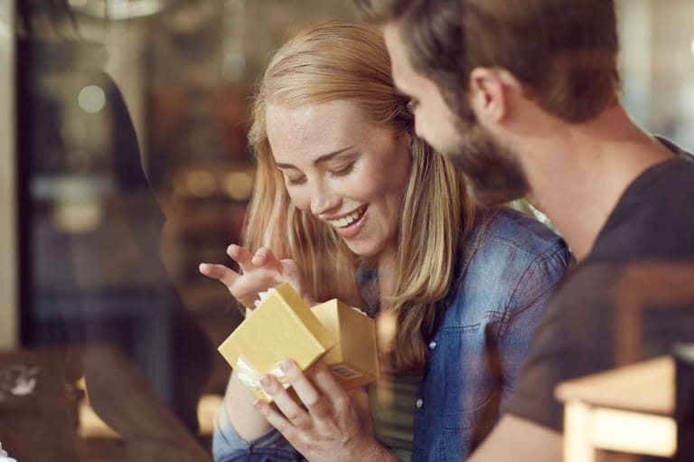 guy giving girl present