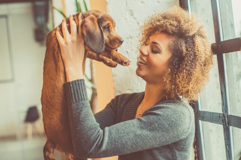 Biracial girl with puppy