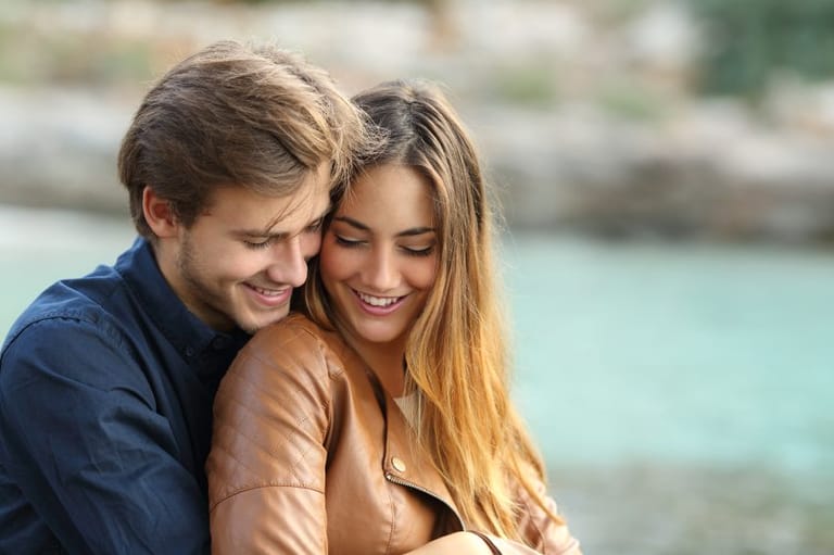 couple cuddling outdoors