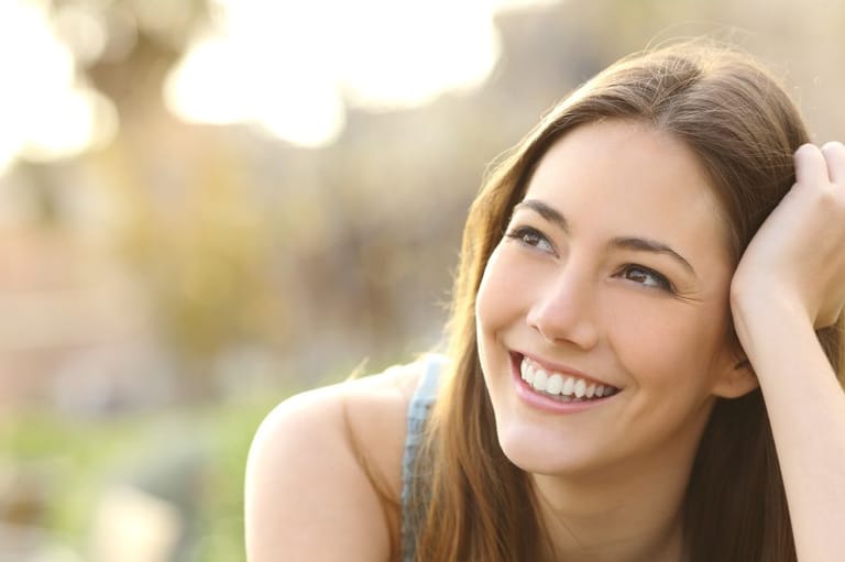 woman in park smiling