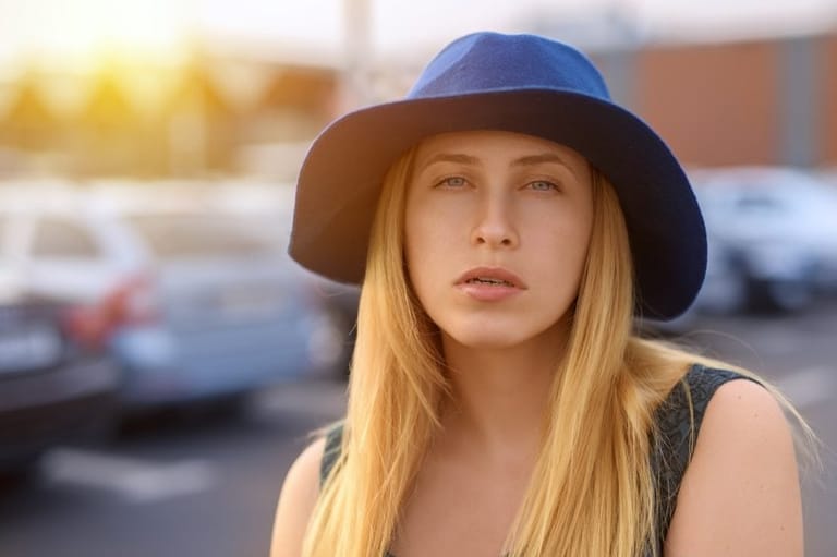 blonde woman with blue hat