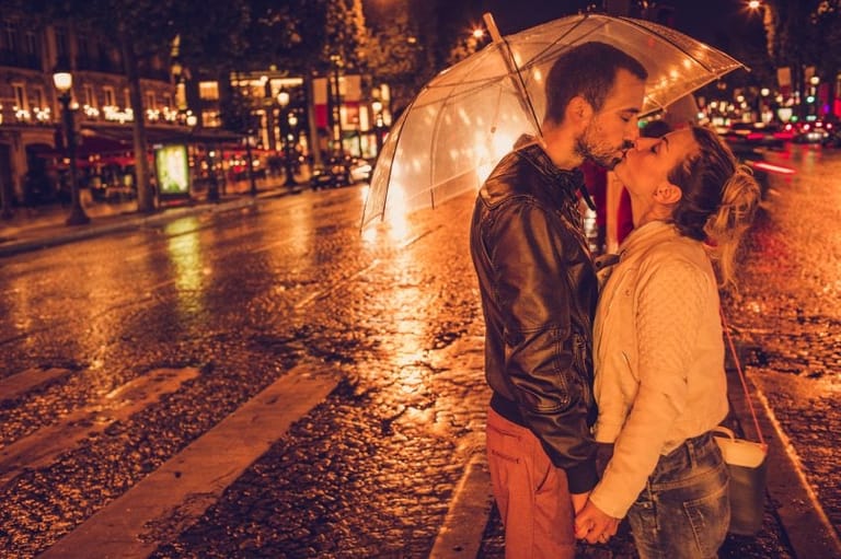 couple outside rain umbrella