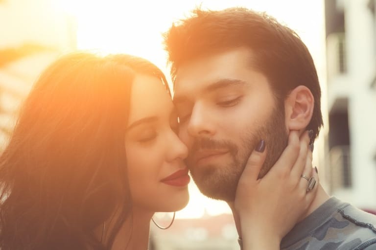 Couple sharing romantic moment at sunset