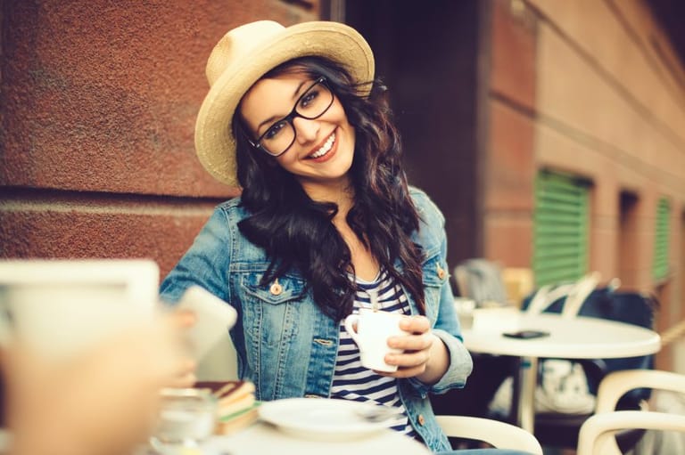 Happy hipster in hat