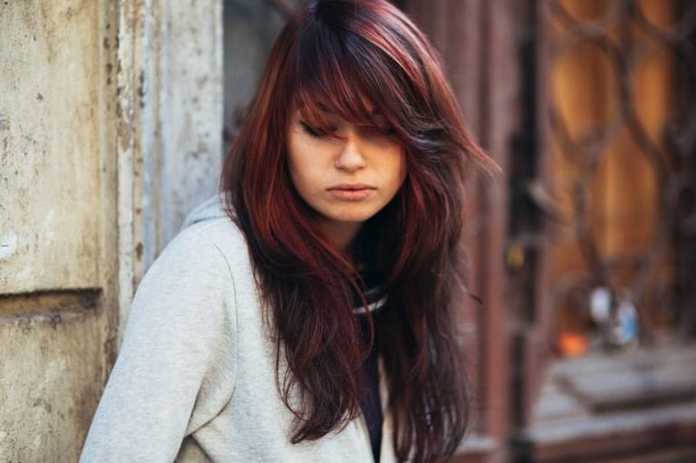 Redhead looking down and sad