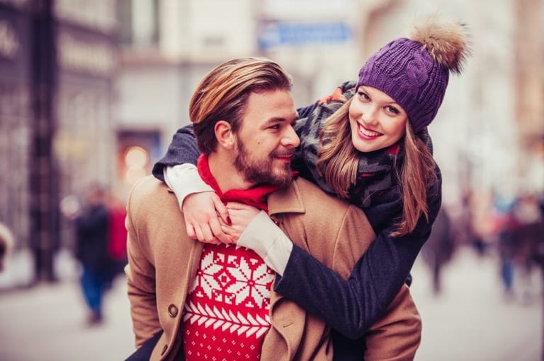 Couple in warm sweaters and hats