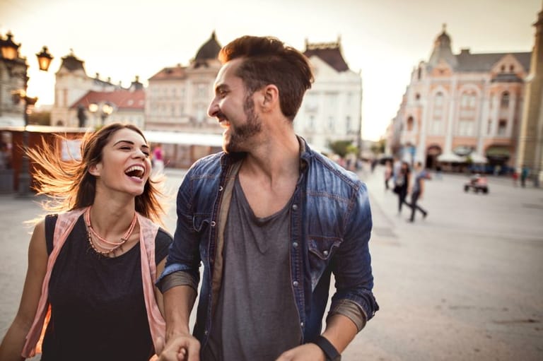 Young cheerful couple laughing