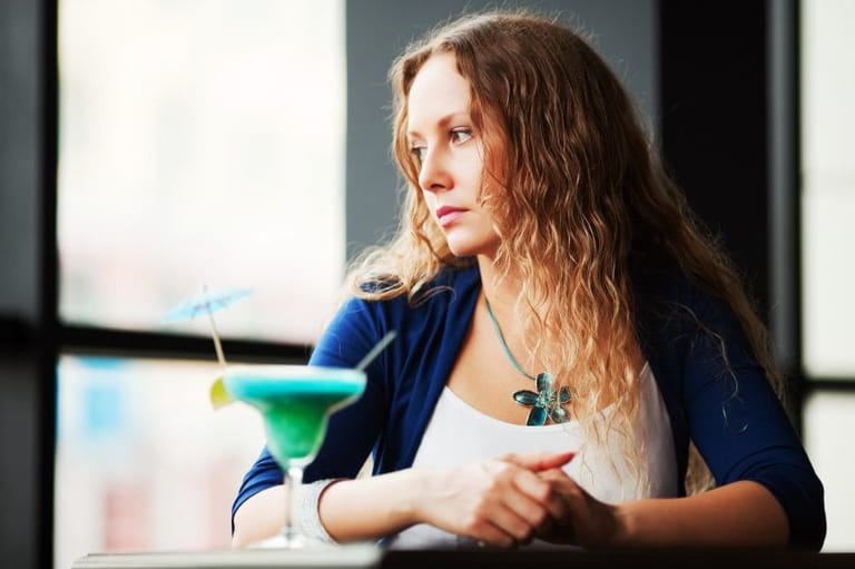 Young woman with a cocktail.