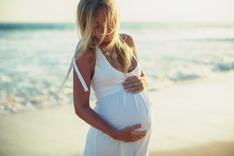 Pregnant woman on the beach