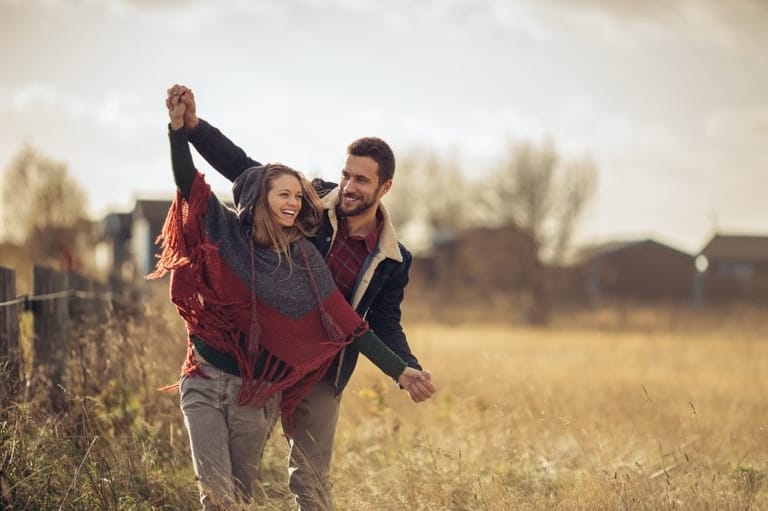 Couple having fun in a field