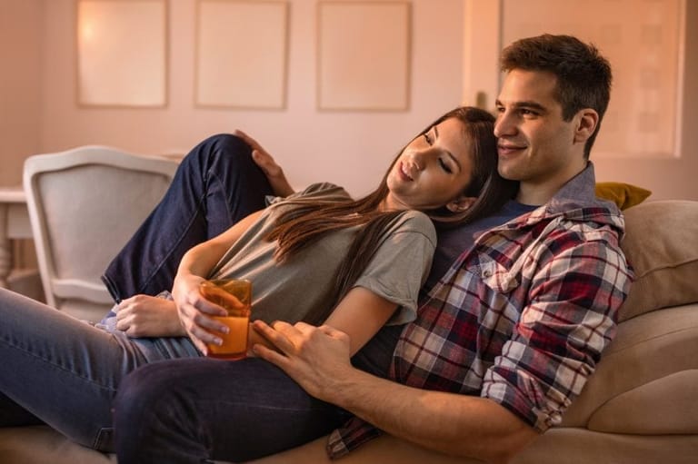 Couple relaxing on couch