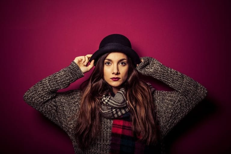 woman in hat and sweater portrait