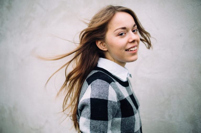 smiling woman in plaid top portrait